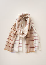 A lightweight woven scarf with a check pattern in beige, white, and muted brown, draped elegantly against a solid light beige background.