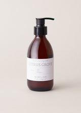 Hand soap bottle labeled 'Citrus Grove' by Bubba & Fox on a beige background