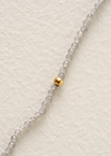 Grey beaded necklace with gold pendant