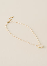 Peal necklace with floral pendant detail