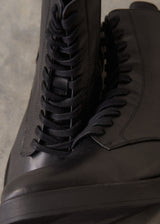 Black leather lace up ankle boots.