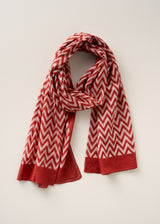 Red and white chevron print cotton scarf made from breathable, lightweight fabric, on a beige background
