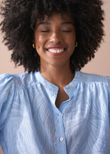 Light blue textured lacey blouse with puff sleeves