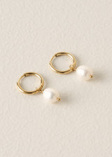 Gold hoop earrings with pearl drops