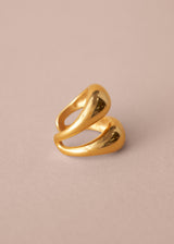 Gold ring on a beige background