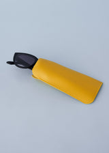 A pair of oversized cat eye sunglasses with black frames and blue lenses