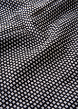 Close up of black and white dot print cotton scarf made from breathable, lightweight fabric