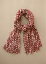 Red polka dot scarf on a beige background