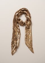 Gold sequin adorned scarf set on a beige background