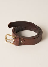 Brown real leather belt with a brushed gold buckle on a beige background