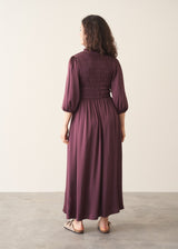 Woman wearing plum satin dress