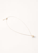 A cluster pearl necklace on delicate gold chain.