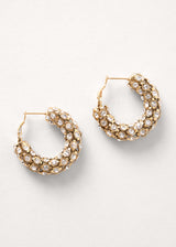 Large crystal gold hoop earrings on white background
