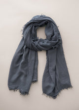 Dusky blue cashmere blend scarf on beige background