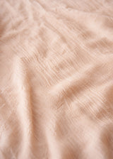 Close up of texture of light pink cashmere mix scarf