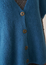 Bright blue knitted sleevless waistcoat