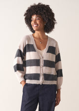Woman wearing a striped mohair cardigan with a plain background