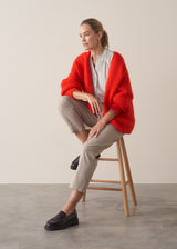 Woman wearing bright red mohair blend cardigan