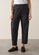 Woman wearing blue black straight leg denim jeans