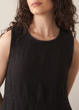 Woman wearing black linen cocoon dress