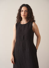 Woman wearing black linen cocoon dress