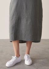 Woman wearing khaki linen tulip dress