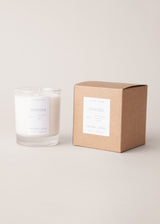 Powder scented candle with notes of black pepper and lemon, on a beige background with gift box
