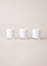 Set of three scented candles, on a beige background