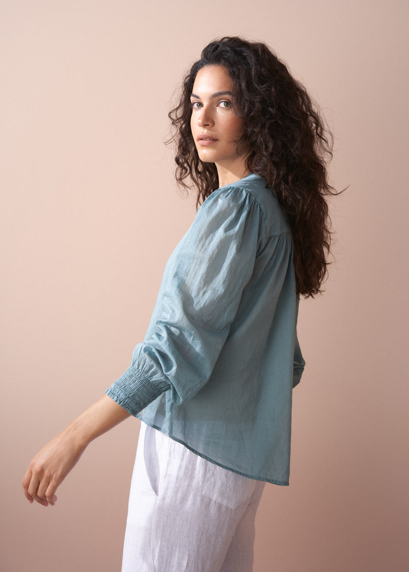 Light sage aqua cotton blouse with shirred cuffs