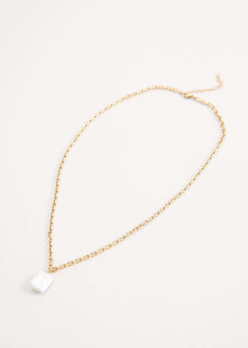 Gold chain necklace with large pearl