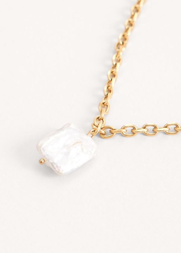 Gold chain necklace with large pearl