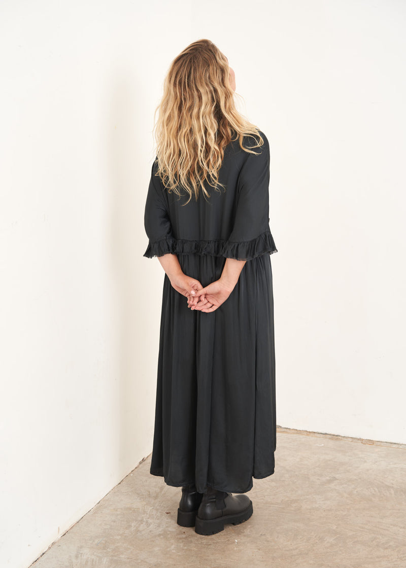 Black satin midi dress with ruffle detail