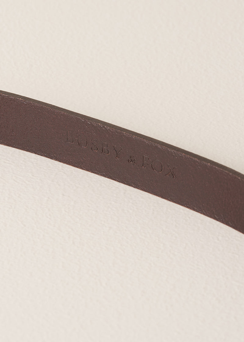 Close-up of a brown leather belt