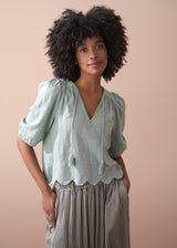 Sage green embroidered top with tassel detail