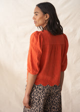 Red puff sleeve blouse with embroidered and scallop hem