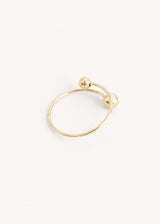 Twisted gold ring with ball details