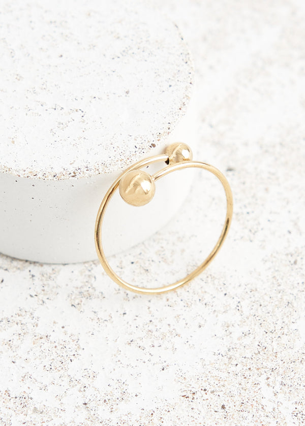 Twisted gold ring with ball details