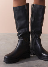 Black boots on a neutral background