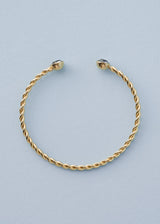 Twisted gold bangle with crystal detail