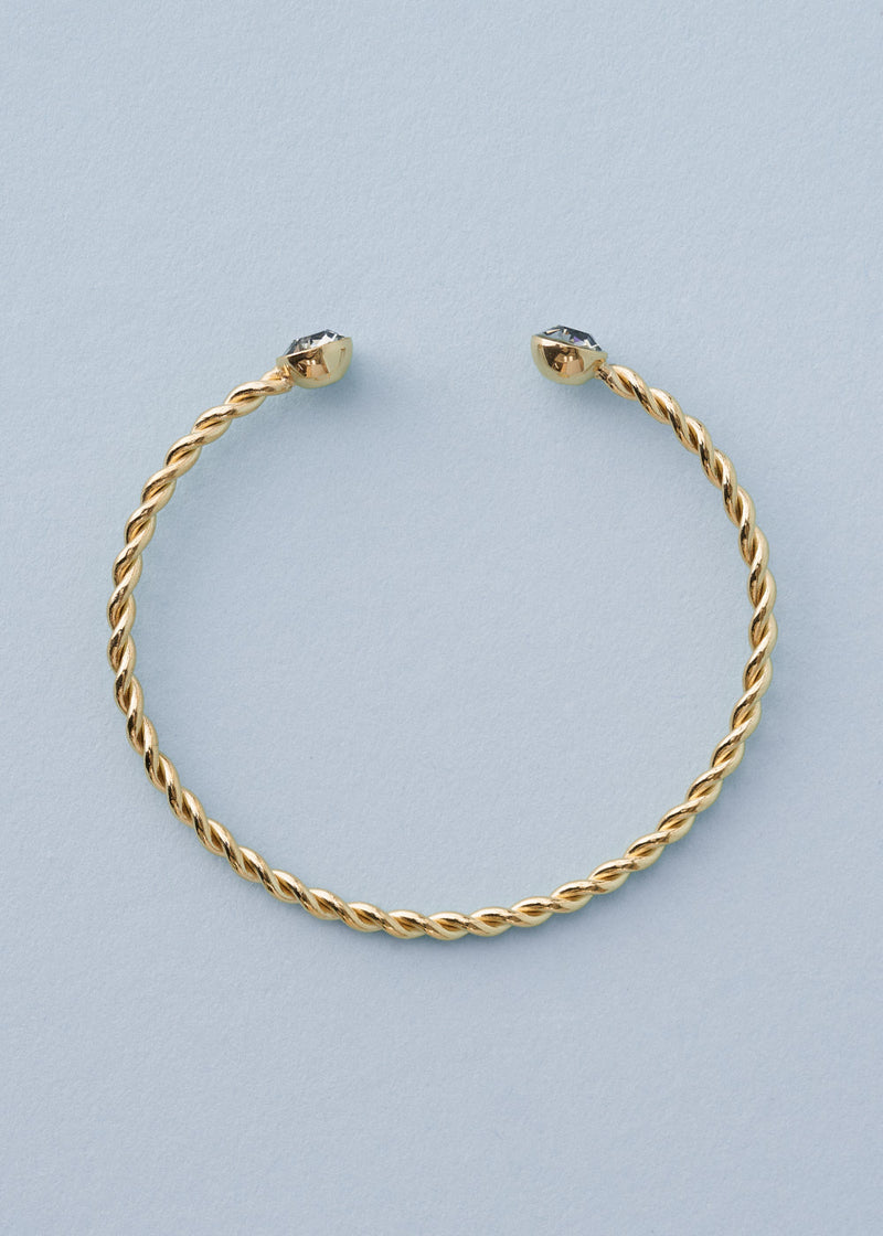 Twisted gold bangle with crystal detail