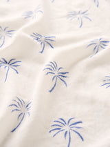 White fabric with blue palm tree pattern