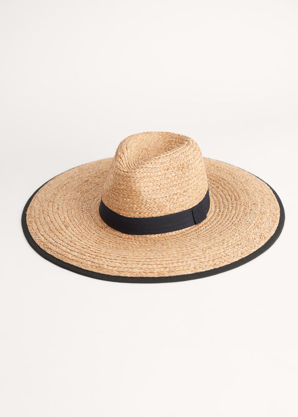 Straw hat with black trim