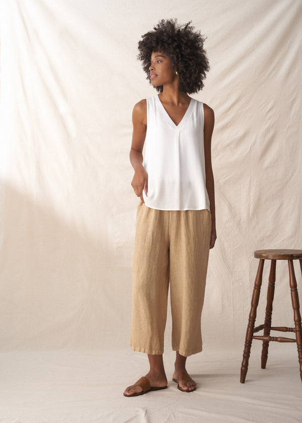 White sleeveless vest top