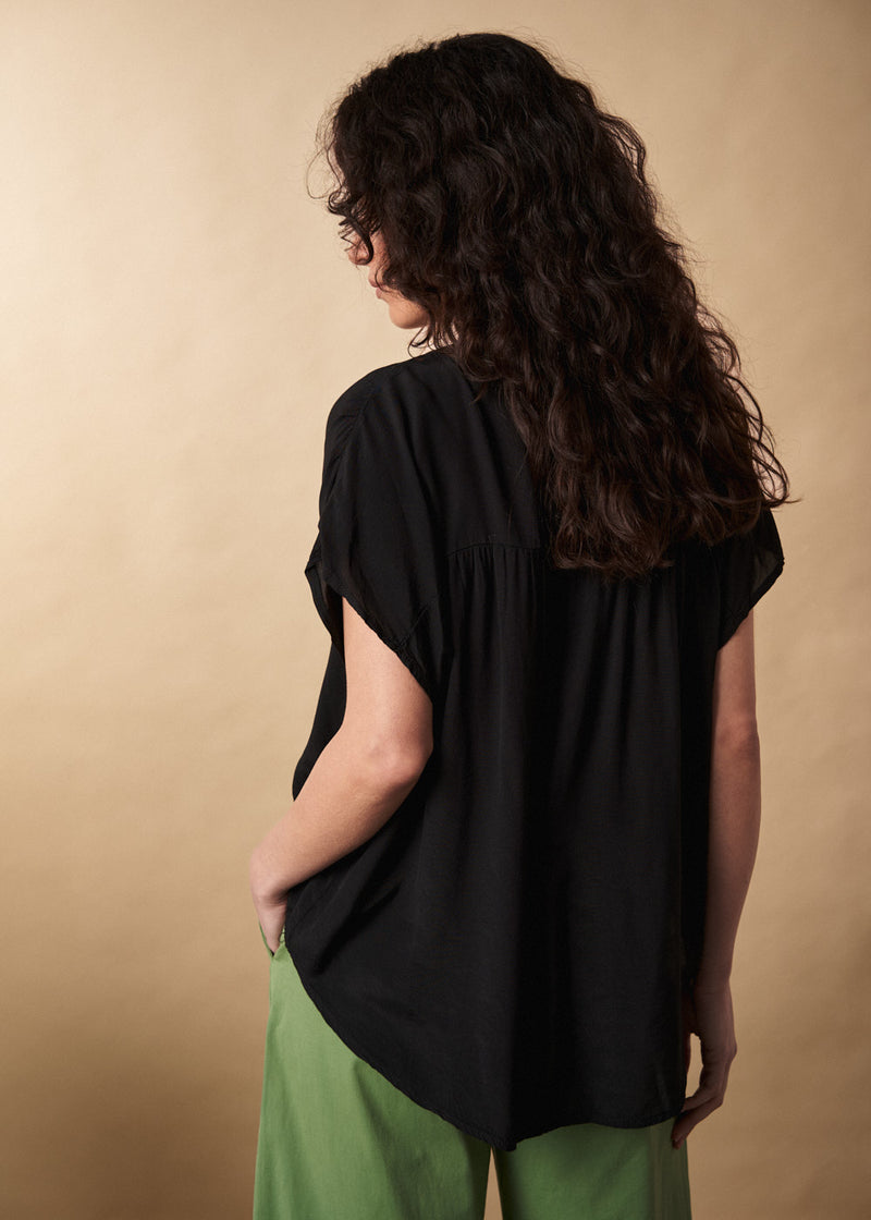 Black lightweight semi-sheer short sleeve top