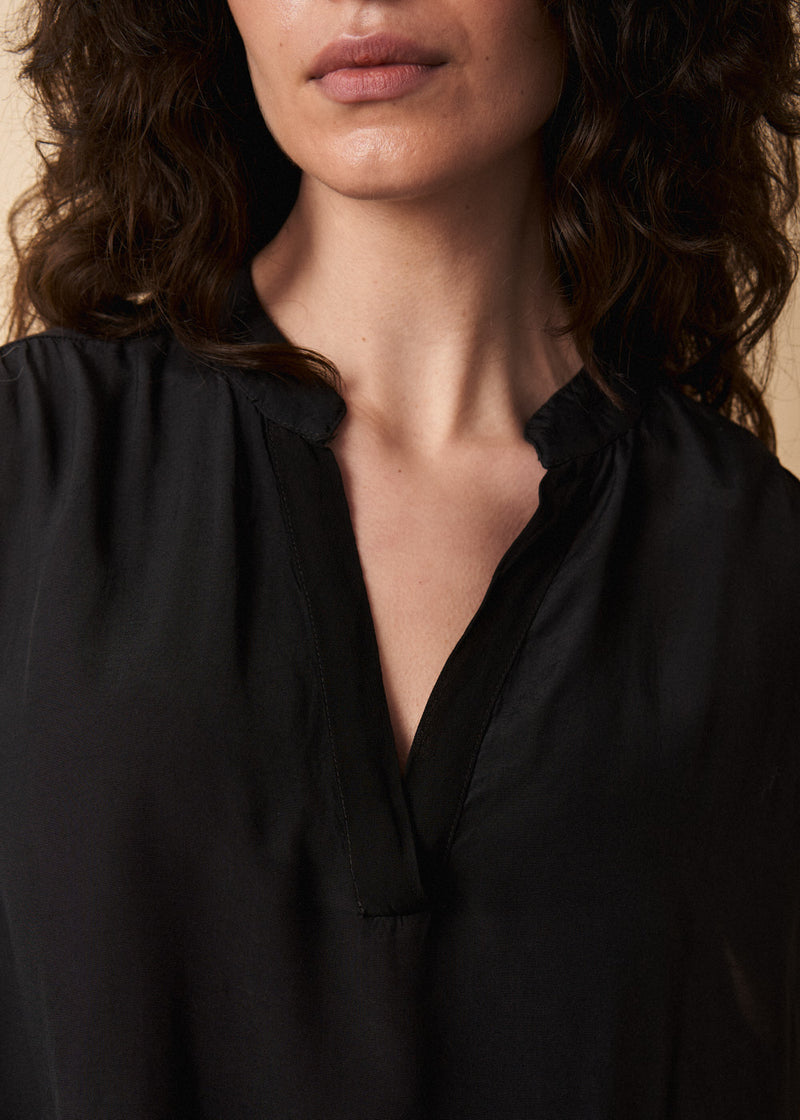 Black lightweight semi-sheer short sleeve top