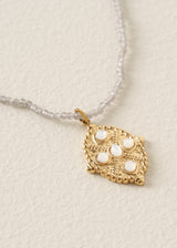 Grey beaded necklace with gold pendant