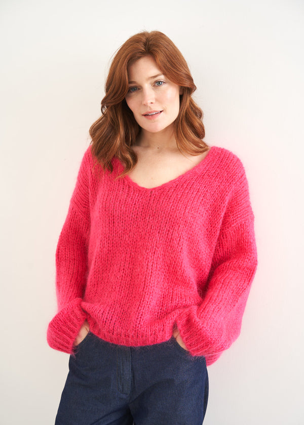 Bright pink knitted sweater with v neck line 