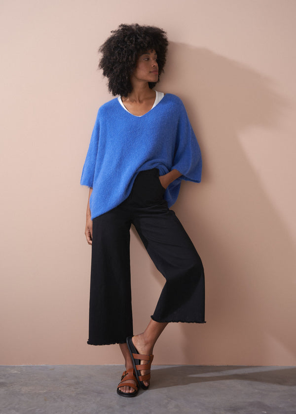 Black wide leg raw hem cotton trousers