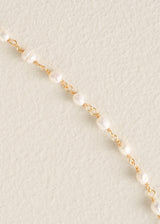Peal necklace with floral pendant detail