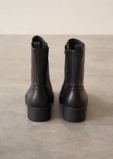 Black leather lace up ankle boots.